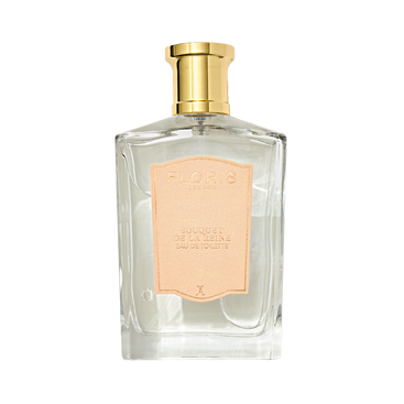 Clear glass bottle of Floris London "Bouquet de La Reine - Eau de Toilette" fruity floral perfume with a gold cap and pale pink label, exuding timeless beauty.