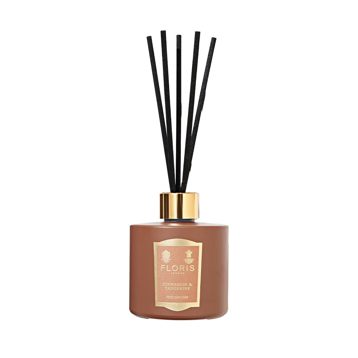 The Floris London "Cinnamon & Tangerine" reed diffuser features black sticks, a gold cap, and a rich scent, set against a plain white background.
