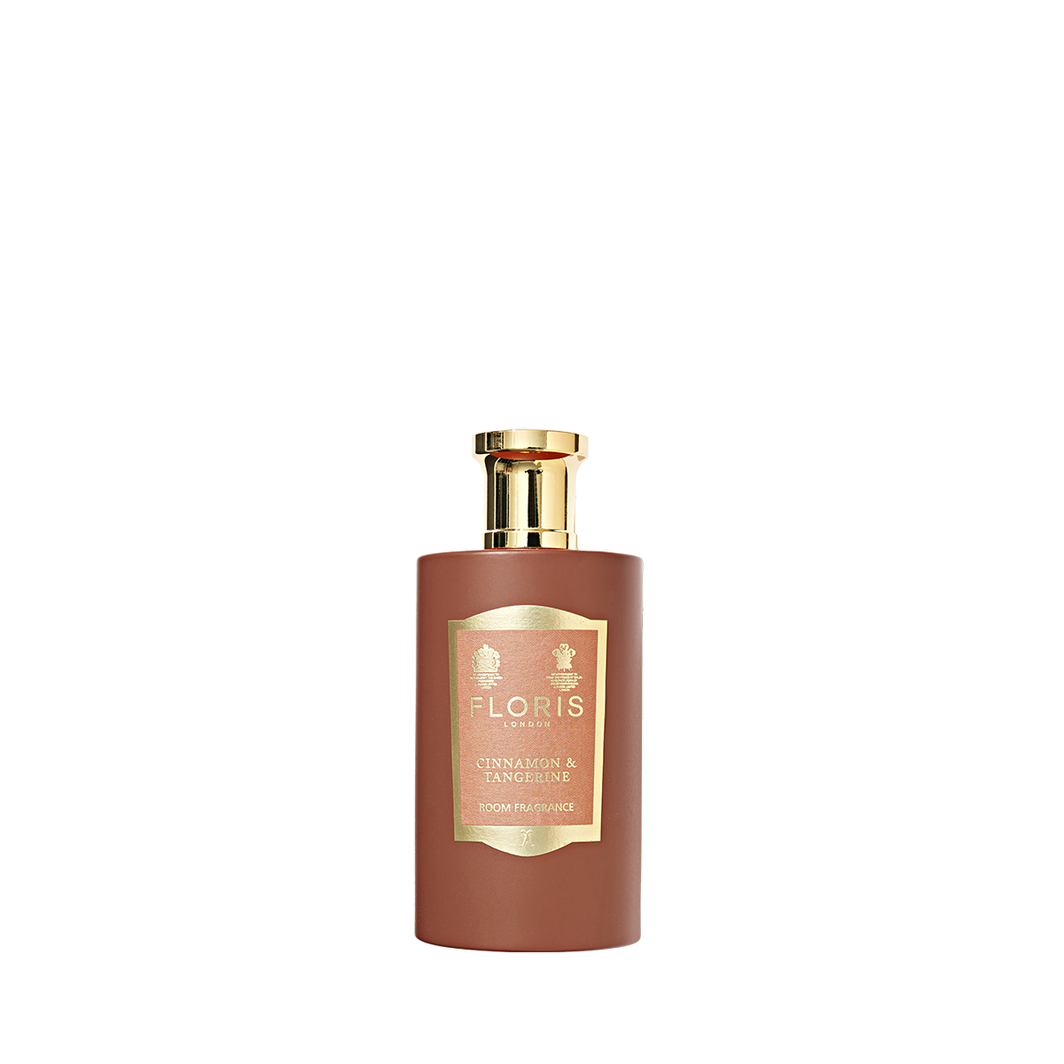 A brown bottle with a gold cap and label reads "Floris London Cinnamon & Tangerine - Room Fragrance," showcasing a rich spice scent. White background.