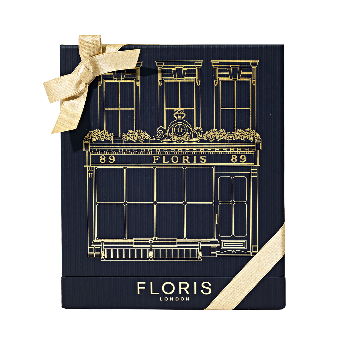 Sweet Lux | Honey Oud Duo by Floris London EU in a navy blue gift box with gold building illustration, gold logo, and gold ribbon bow on top left.