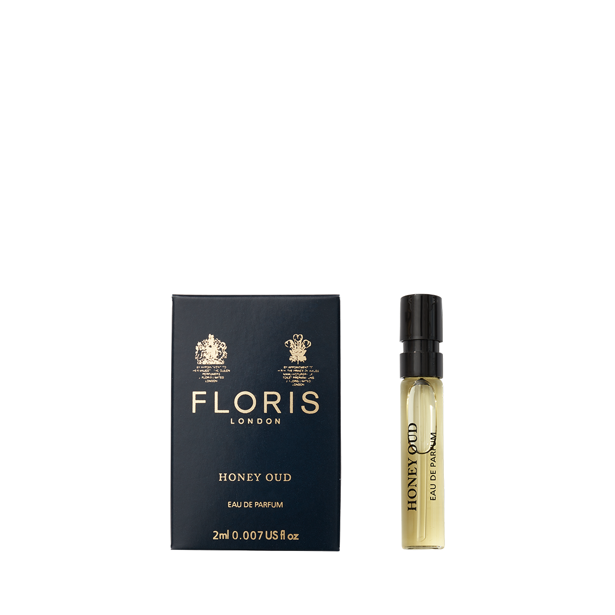 A 2ml spray vial of Floris London Honey Oud - Eau de Parfum rests beside its dark blue and gold box, featuring rich oud oil and English honey.