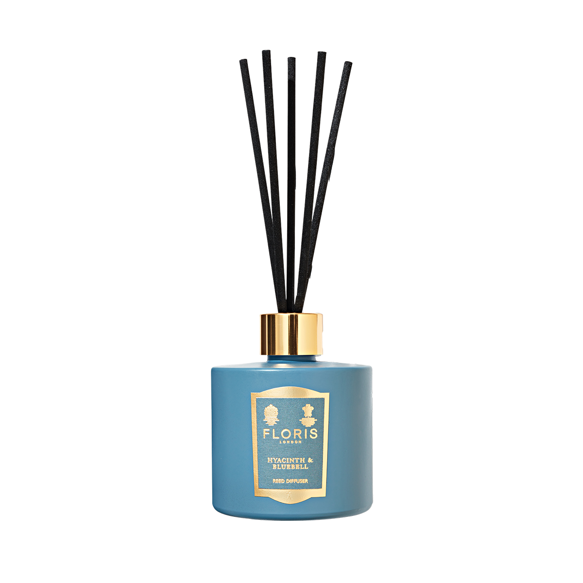 A Hyacinth & Bluebell Reed Diffuser by Floris London, with a blue bottle, gold label and cap, and black reeds, evokes a fresh green floral scent.