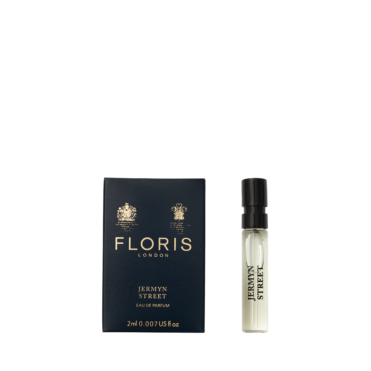 A sample vial of Floris London Jermyn Street Eau de Parfum rests beside its blue, gold-embossed box, showcasing a refined vetiver scent.