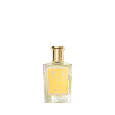 A clear glass bottle of Floris London Stephanotis Bath Essence with a gold cap and yellow label, displayed against a plain white background.