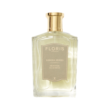 A clear glass bottle of Floris London EU Vetiver, a long-lasting vetiver fragrance with amber notes, photographed on a plain background.
