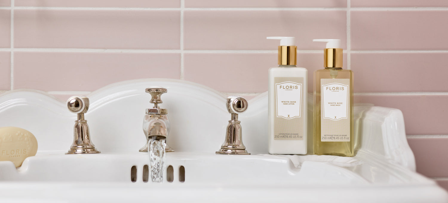 The White Rose hand collection placed on a white porcelain sink with running water