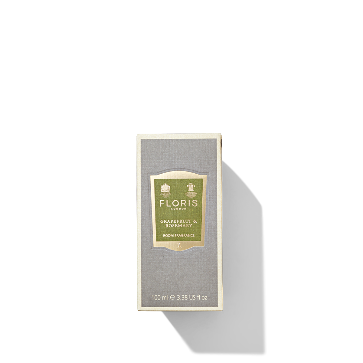 Grey packaging box with gold and green label for the grapefruit and rosemary room fragrance.