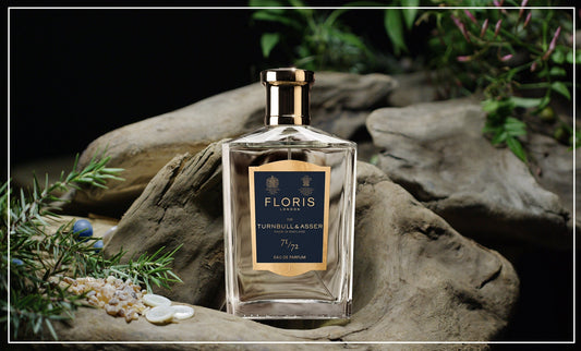 71/72 Eau de Parfum on a rock and a dark green outside background