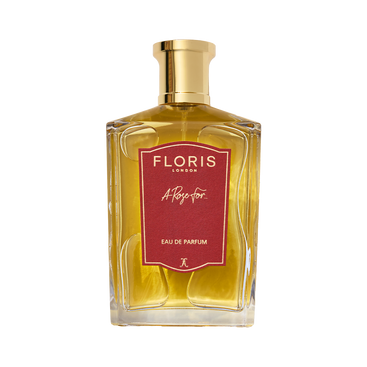 A clear glass bottle of Floris London A Rose For... - Eau de Parfum, an oriental rose scent, with a gold cap and red front label.