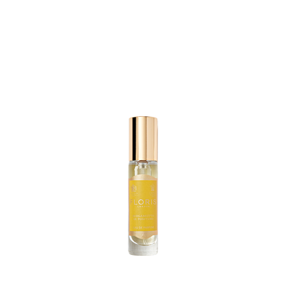 A small glass bottle of Floris London’s Bergamotto di Positano Eau de Parfum holds yellow liquid with a fresh, vibrant unisex bergamot scent.