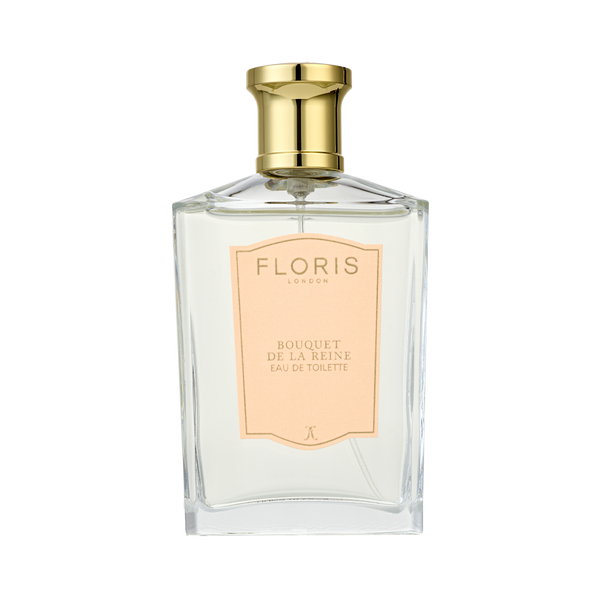 A clear Floris London bottle with a gold cap and peach label reads "Bouquet de La Reine - Eau de Toilette," a luxury fruity floral scent.