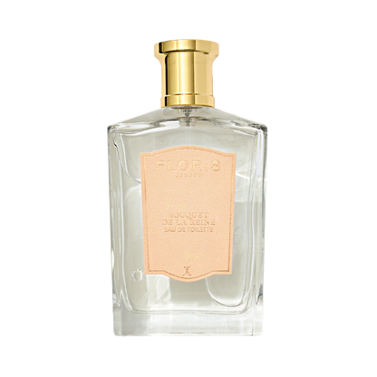 Clear glass bottle of Floris London "Bouquet de La Reine - Eau de Toilette" fruity floral perfume with a gold cap and pale pink label, exuding timeless beauty.