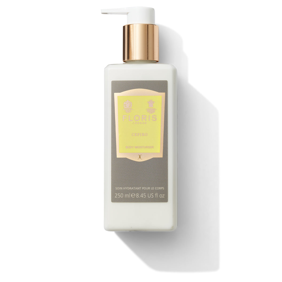 A Floris London Cefiro - Enriched Body Moisturiser in a rectangular, white bottle with a gold pump and label. Infused with anti-ageing vitamin E and the exquisite Cefiro fragrance, this luxuriously scented moisturiser comes with 250 ml (8.45 fl oz) of product.