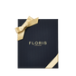 A black Floris London EU Cefiro Hero | Cefiro Duo gift box with gold lettering and a gold ribbon, displayed on a plain white background.