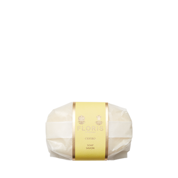 A bar of Floris London Cefiro Soap with a citrus scent, wrapped in translucent paper with a gold and yellow label, set on a plain white background.