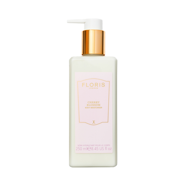 A white bottle of Floris London UK Cherry Blossom - Enriched Body Moisturiser with a gold pump and pink label.