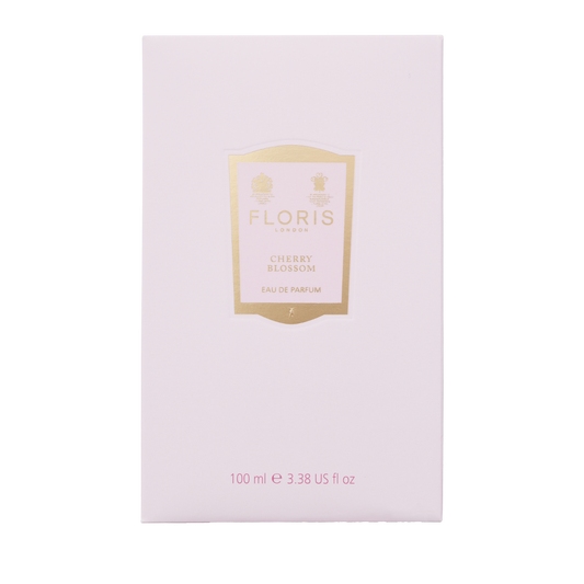A rectangular pale pink box of Floris London Cherry Blossom Eau de Parfum, 100ml, with a gold and white front label and a floral fruity scent.