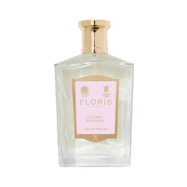 Floris London's Cherry Blossom Eau de Parfum, in a clear glass bottle with a gold cap and pink label, exudes luxury and elegance.