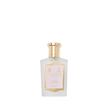 Floris London Cherry Blossom Hair Mist—a clear glass bottle with a gold cap and gold-trimmed label—displayed on a plain white background.
