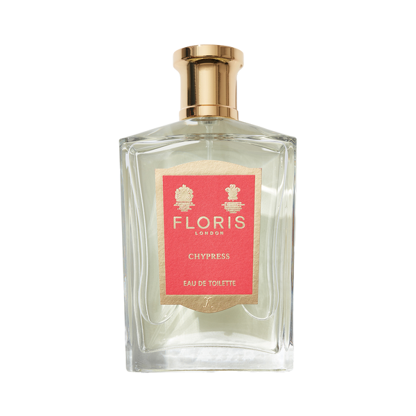 Perfume bottle with a gold cap, red label from Floris London featuring "Chypress - Eau de Toilette," infused with bergamot zest.