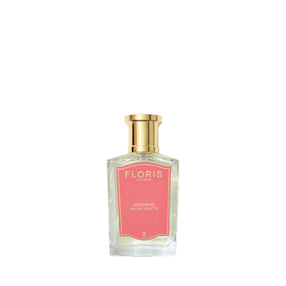 A clear glass bottle of Floris London Chypress Eau de Toilette, featuring bergamot zest and floral chypre notes, sits against a white background.