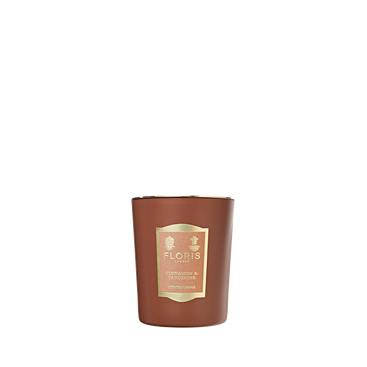 A brown Floris London "Cinnamon & Tangerine" candle, hand poured and richly scented, stands upright against a white background.
