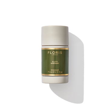 A cylindrical container of "Elite - Deodorant Stick" by Floris London EU, 75 ml (2.5 fl oz), adorned with a green and gold label, is photographed against a white background. This alcohol and aluminium-free deodorant is ideal for sensitive skin, providing an antibacterial solution for long-lasting freshness.