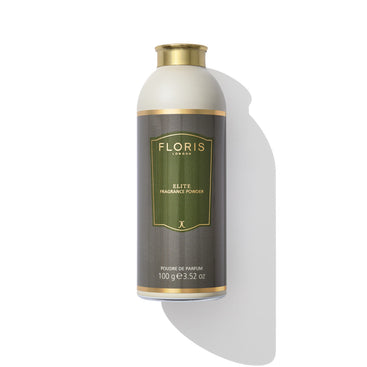 A bottle of Floris London EU Elite - Fragrance Powder enhanced with aloe vera. The cylindrical bottle features a green and gold label, holding 100 grams or 3.52 ounces of refined powder.