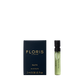 A box labeled "Elite - Eau de Toilette" by Floris London stands beside a 2 ml spray vial, highlighting the woody scent’s classic British style.