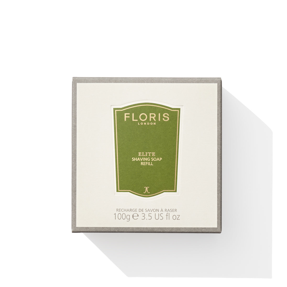 Box of Floris London EU Elite - Shaving Soap Refill, 100g (3.5 oz), enriched with shea butter and featuring woody notes, elegantly presented in green and white packaging against a pristine white background.