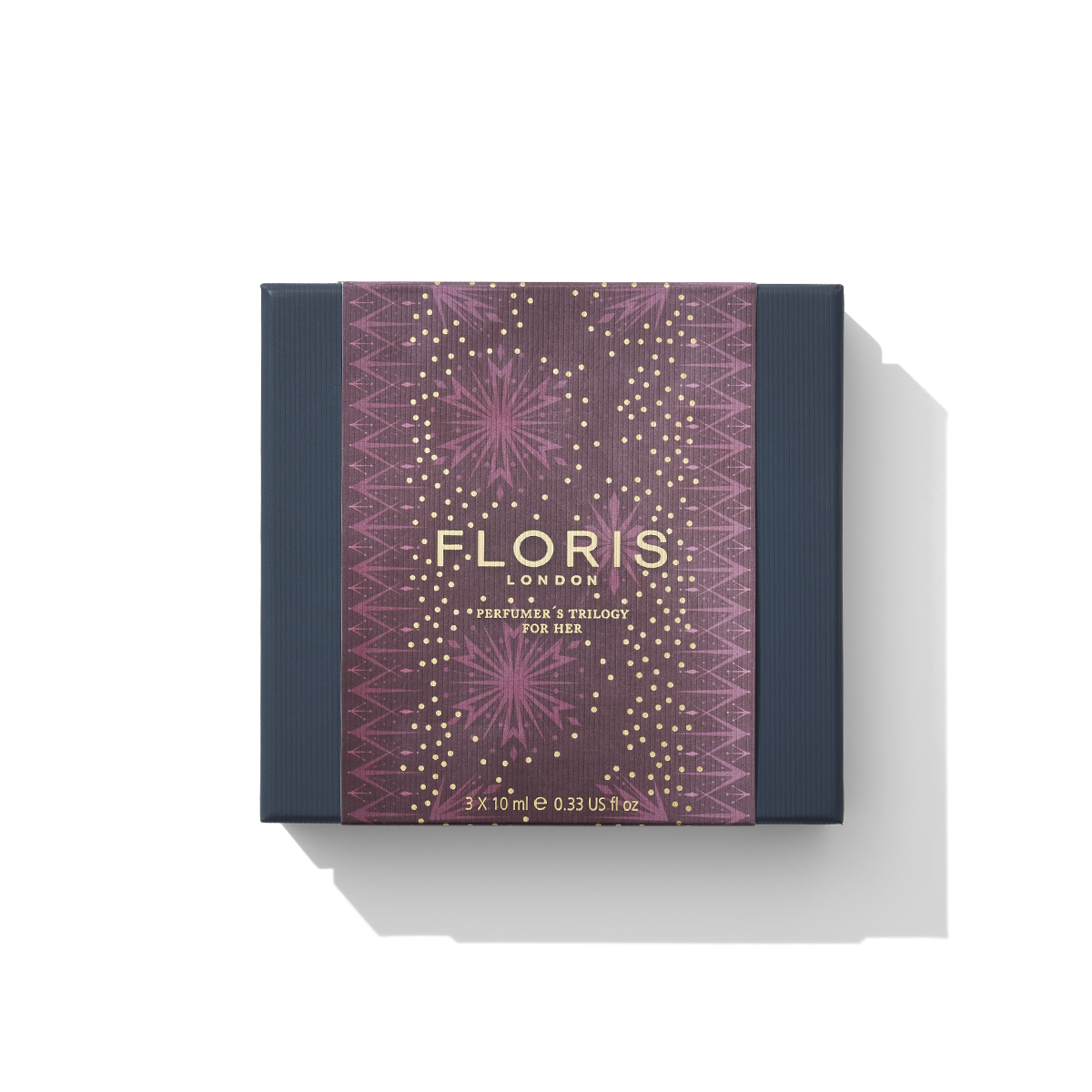 A boxed set of Perfumer's Trilogy: For Her by Floris London EU, adorned with a decorative purple and gold design on the packaging—a true celebration of fragrances.