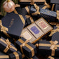 A boxed Soap Collection For Her from Floris London, featuring three exquisite soap products, nestled in-between beautifully gift wrapped presents. This luxurious gift set is perfect for the holiday season.