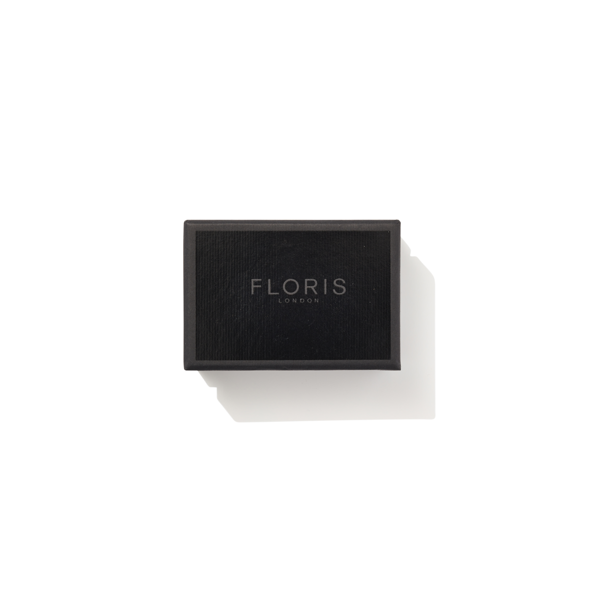 Rectangular black box with "Floris London EU" in silver on white—Elite Soap, valued for its refined elegance and woody fragrance.