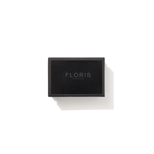 Rectangular black box with "Floris London EU" in silver on white—Elite Soap, valued for its refined elegance and woody fragrance.