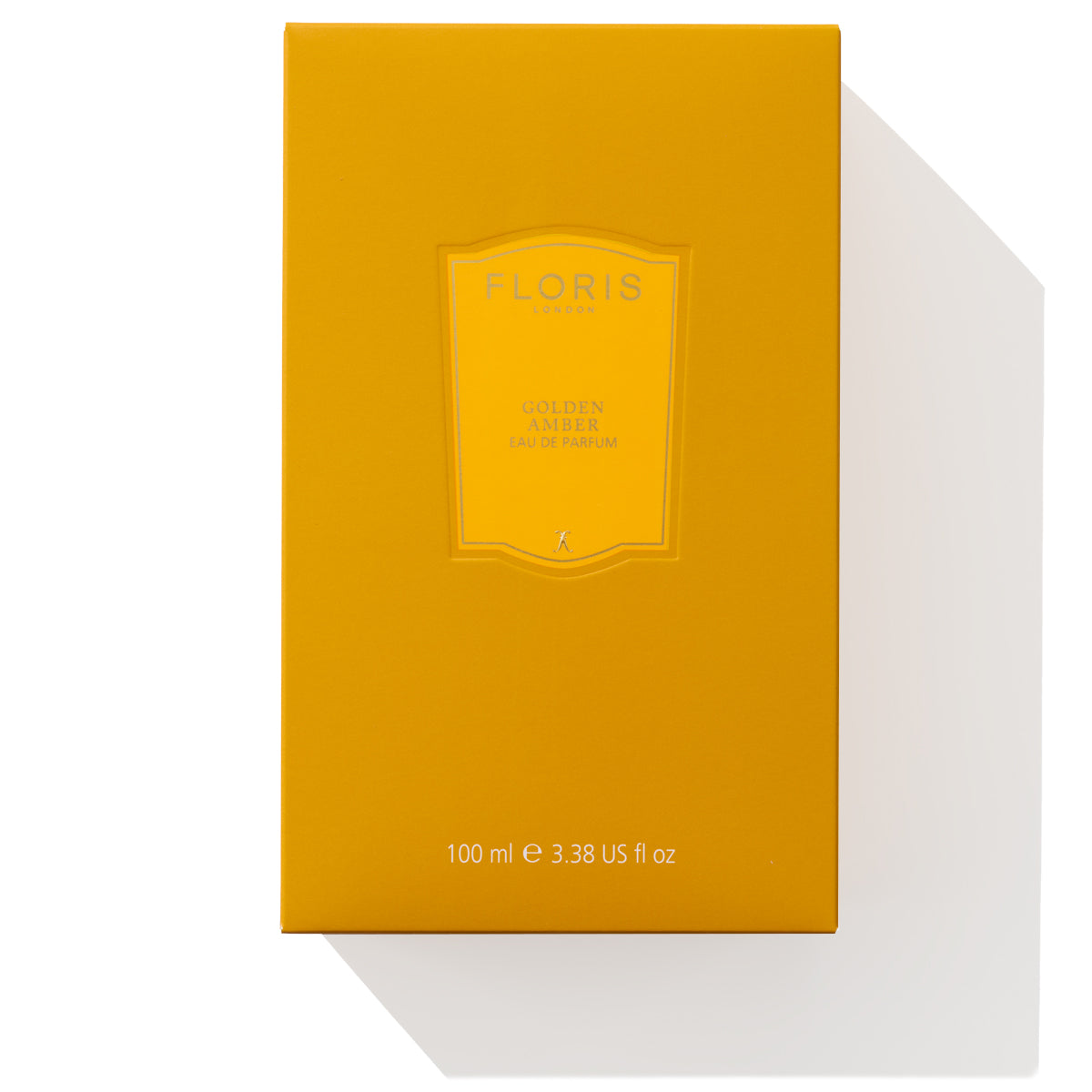 An orange box labeled "Golden Amber - Eau de Parfum" by Floris London, featuring aquatic notes and a floral heart, with "100 ml e 3.38 US fl oz" written on it.