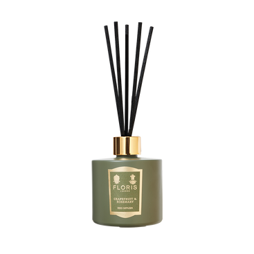 The Floris London Grapefruit & Rosemary Reed Diffuser fills any space with a fresh grapefruit scent and comes with black reeds and a gold label.