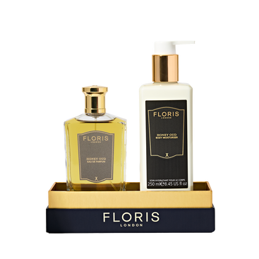 The Sweet Lux | Honey Oud Duo from Floris London EU includes a Honey Oud Eau de Parfum and Body Moisturiser in a gold and black display tray.