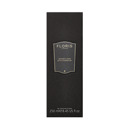 Black rectangular Floris London UK Honey Oud Bath & Shower Gel, 250ml, with gold and white text. Contains nourishing oud oil.