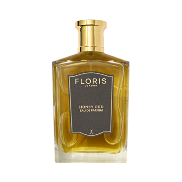 A rectangular glass bottle of Floris London Honey Oud Eau de Parfum, featuring notes of English honey and oud, is shown on a white background.