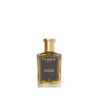 Floris London Honey Oud - Eau de Parfum features a gold cap, gold label, and amber liquid, infused with English honey and oud oil.
