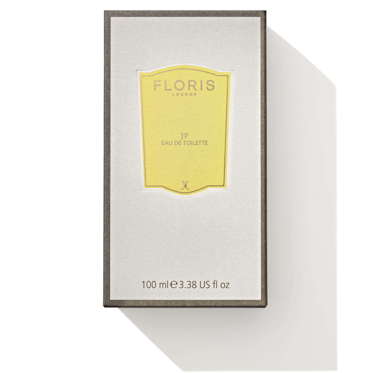 A packaged Floris London JF Eau de Toilette box features a yellow label adorned with gold accents and text. This classic signature fragrance for men combines citrus and woody notes, with the volume marked as 100 ml (3.38 US fl oz) at the bottom.