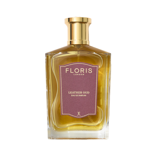 A bottle of Floris London's Leather Oud Eau de Parfum, featuring a gold cap and brown label, enhanced with oud oil.