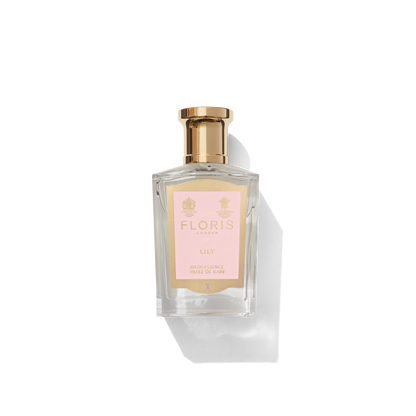 Lily Bath Essence in medium glass bottle with light pink and gold label 
