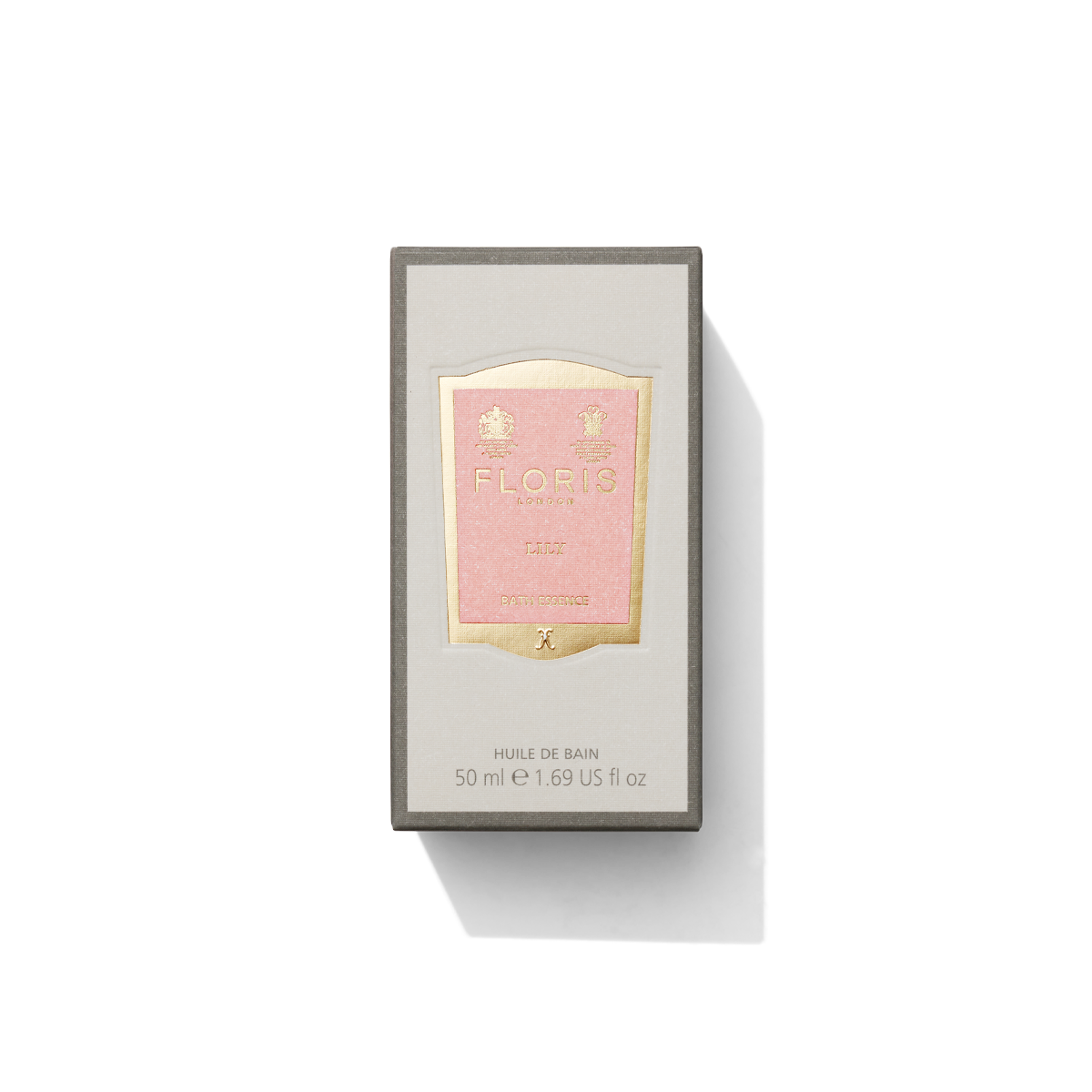Medium grey box with light pink and gold label containing Lily Bath Essence 