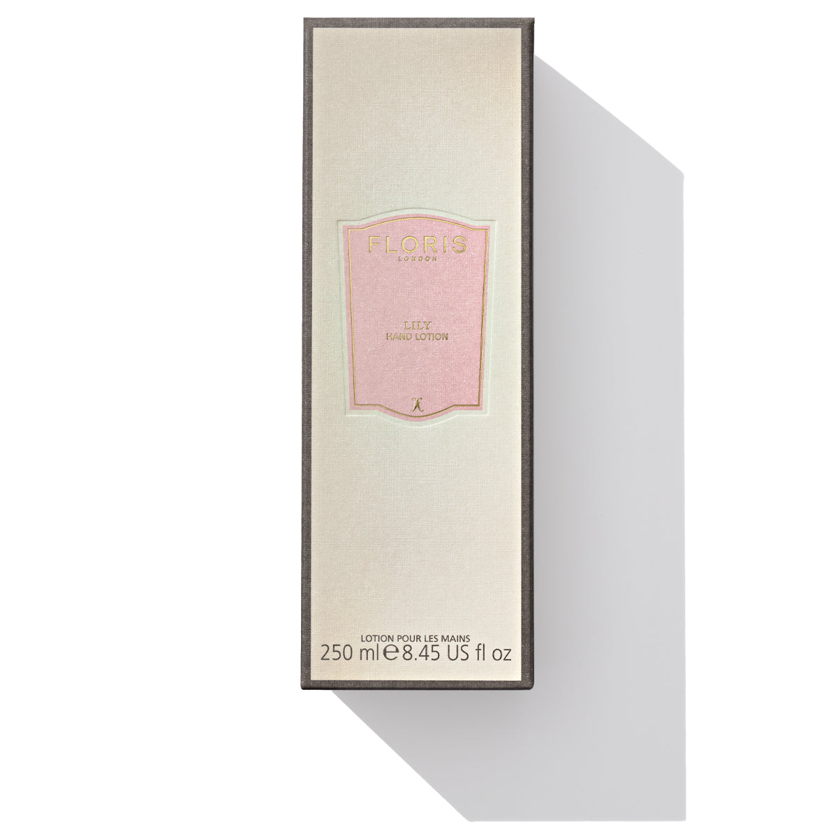 A rectangular box with a cream and pink colored label containing Floris London EU's Lily - Luxury Hand Lotion, enriched with sweet almond oil, 250 ml (8.45 US fl oz), perfect for dry skin.