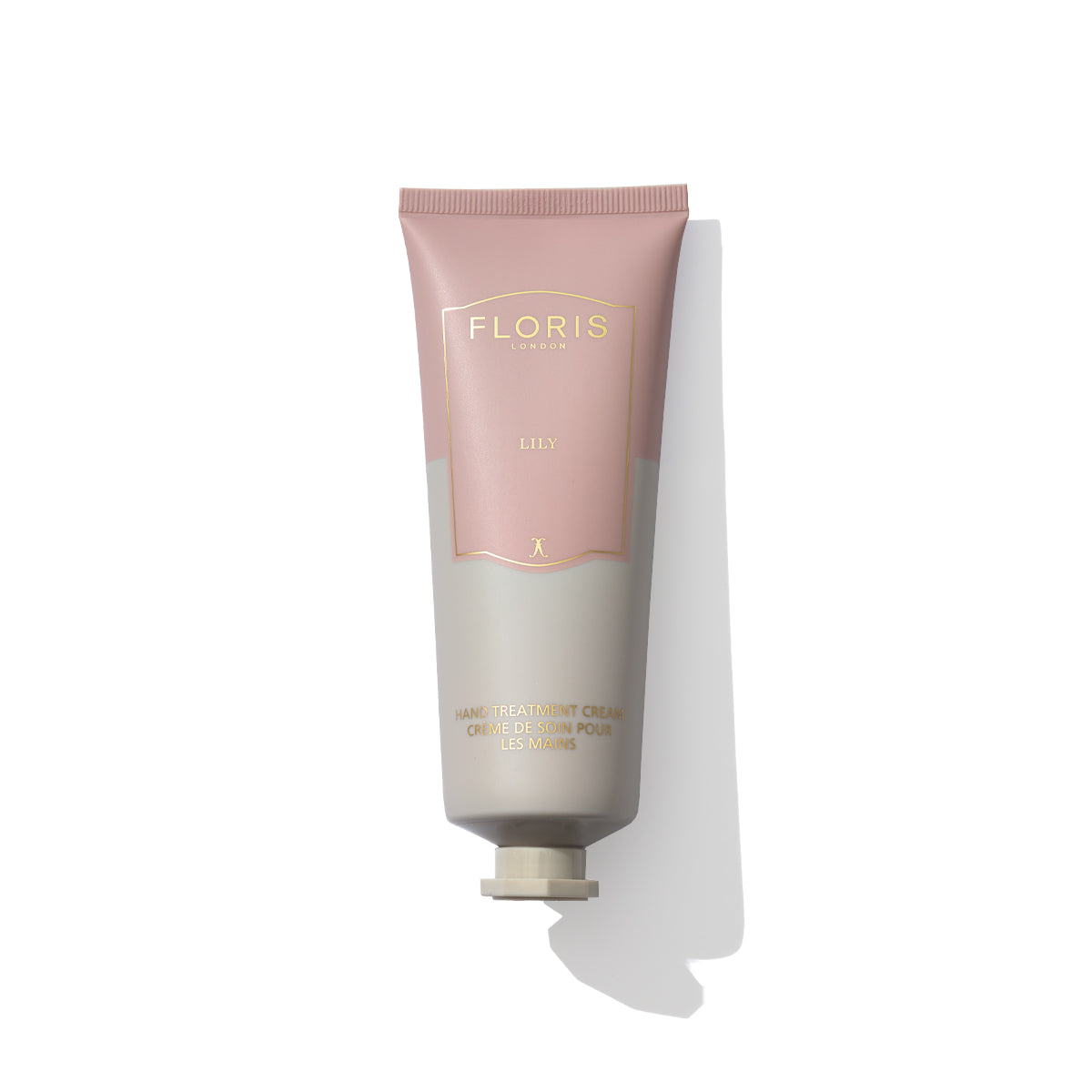 A tube of Lily - Hand Treatment Cream by Floris London EU, renowned as one of the best hand creams for very dry hands, featuring a pink and grey design, placed against a white background.