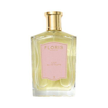 A clear glass bottle of Floris London EU Lily - Eau de Toilette, featuring a gold cap, pink label, and yellow liquid with lily of the valley notes.