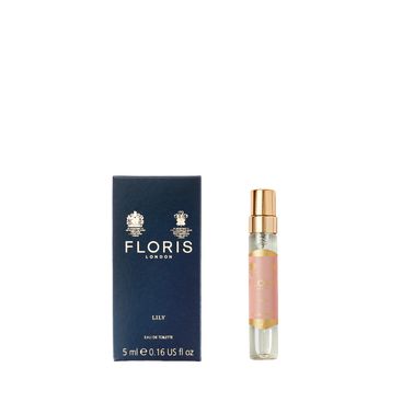 A small blue box labeled "Floris London Lily - Eau de Toilette 5ml" stands next to a spray bottle—an elegant floral scent with Lily of the Valley.