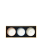 The Floris London EU Miniature Candle Collection features three round candles—pink, blue, and white—in a rectangular box against a plain background.