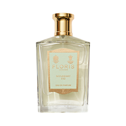 Floris London Mulberry Fig Eau de Parfum: a rectangular glass bottle with gold cap, beige label, and a woody fig scent.